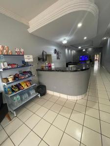 a fast food restaurant with a counter in a store at Plaza Hotel in Itaituba +11 photos
