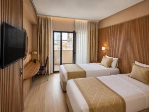 Llit o llits en una habitació de Classes Hotel Airport