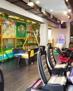 a gym with a ping pong table and chairs at GetAp Resort Arzni in Arzni