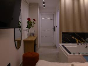 a bathroom with a tub and a sink and a mirror at Rentalica in Belgrade +7 photos