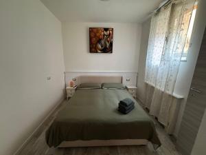 a bedroom with a bed in a white room at Artdeco in Lecco