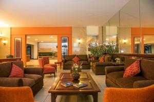 a living room with couches and a table at San Agustin Riviera in Lima +18 photos