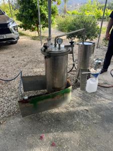 an outdoor stove with two buckets at Pervolaris Cottages 1 in Goudhi