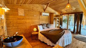 a bedroom with a bed and a tub in a room at Heaven Resort Faralya in Fethiye +101 photos