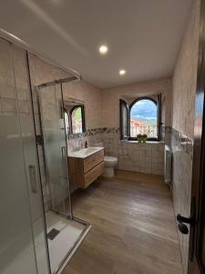 a bathroom with a shower and a toilet and a sink at Casa Dulcinea en Brañosera Montaña Palentina. in Brañosera