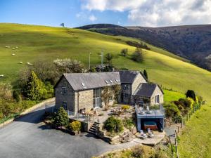 an aerial view of a house in a field at 5 Bed in Llangammarch Wells oc-bn162 in Garth