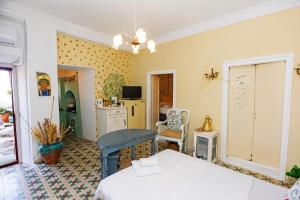 a bedroom with a bed and a refrigerator at Danielle 626 House Ano Syros in Ano Syros