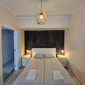 a bedroom with a large bed with two night stands at Landmark 1BDR Apartment in Center, next to Metro in Sofia