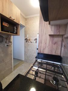 a kitchen with a stove top oven in a room at High quality apartment Madinty in Cairo +4 photos