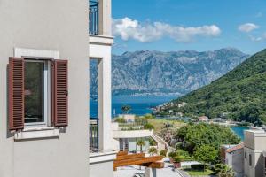 a view of the water from a building at Lavender Bay Apartment C21 in Donji Morinj