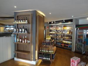 a store with a lot of bottles of wine at Landscape Beira Mar in Fortaleza