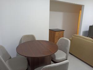 a conference room with a table and chairs at High quality apartment Madinty in Cairo