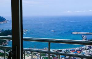 a view of the ocean from a hotel window at Pension Ora in Samcheok