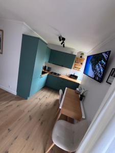 a living room with a table and a couch at View Apartments Gorlice in Gorlice