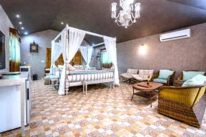 a living room with a couch and a crib at Resort Terra Paraiso Goa - A Beach Property in Calangute +50 photos