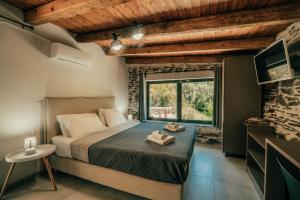 a bedroom with a bed in a room with a window at Ellafos Traditional Living-Elafonisi Couples Retreat in Elafonisi +136 photos