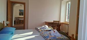 a bedroom with a bed with shoes on it at Maso Montel in Barco