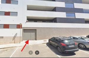 a car parked in a parking lot in front of a building at Rooftop pool & Luxury apartment in Lagos