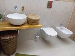 a bathroom with a sink and a toilet at Il rifugio del cuore in San Massimo +51 photos