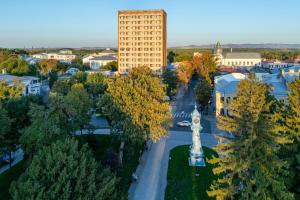 an aerial view of a city with a tall building at Hotel Traian in Brăila