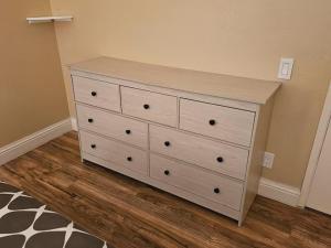 a white dresser in a room with at Urban Retreat -Suite B in San Jose