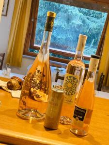 three bottles of wine sitting on top of a table at Centrale in Courmayeur