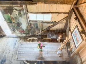 an overhead view of a room with a table and chairs at Seaside Boathouse In Veiholmen in Smøla