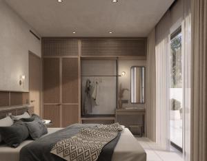 a bedroom with a large bed and a bathroom at Eleni Village & Suites in Amoudara Herakliou