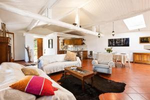 a living room with a couch and a table at Villa Amore in Cannobio