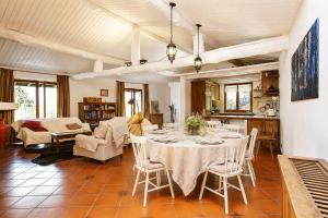 a kitchen and living room with a table and chairs at Villa Amore in Cannobio