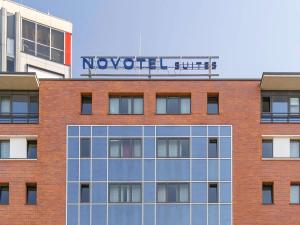 a building with a sign on top of it at Novotel Suites Berlin City Potsdamer Platz in Berlin