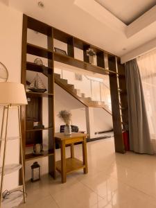 a loft bed with a desk in a room at Plenty Residence by Splendid Hotel, Retreat & Group Stay Near Kigali in Runda