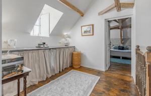a kitchen with a counter and a sink in a room at Manoir du Village in Irais