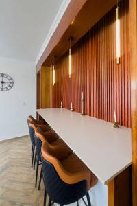 a conference room with a long table and chairs at Plenty Residence by Splendid Hotel, Retreat & Group Stay Near Kigali in Runda