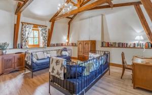 a living room with a couch and a table at Manoir du Village in Irais