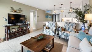 a living room with a couch and a table at 4409 Ocean Pointe Suites in Tavernier