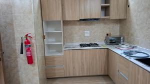 a kitchen with a fire hydrant hanging from the wall at Cherished Homes in Ikeja