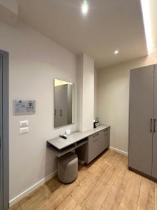 a bathroom with a sink and a mirror at Illyrian Boutique Hotel in Sarandë +66 photos