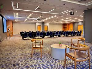 a conference room with tables and chairs in a room at Novotel Santiago Vitacura in Santiago +204 photos