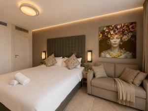 a hotel room with two beds and a couch at Villa Gardenya וילה גרדניה אילת in Eilat