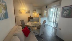 a living room with a couch and a table at Sepic Apartments in Opatija