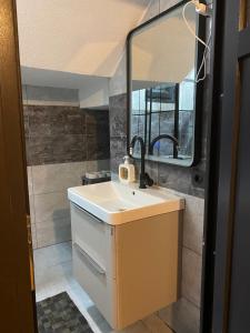 a bathroom with a sink and a mirror at Doğa ile başbaşa dağ evi in Karadere +42 photos