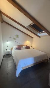 a bedroom with a large white bed in a room at Sepic Apartments in Opatija