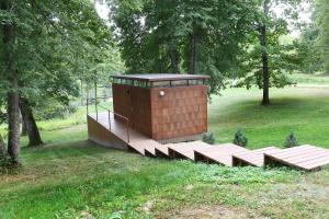 a small building on a wooden platform in a park at IRON Cabin in Gaylyunay