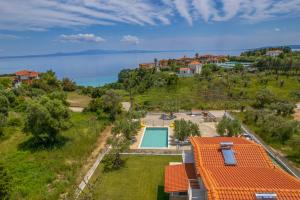 an aerial view of a house with a swimming pool at Petra Serenity Villas in Afitos