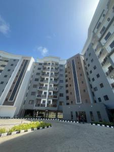 a large apartment building with a courtyard in front of it at D'Empire in Lekki