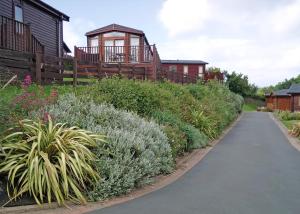 a garden with a path leading to a house at Bossiney Bay in Tintagel