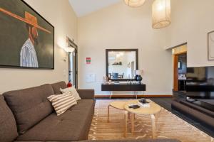 a living room with a couch and a table at Sweet Orchard Escape - By Wehost in Porto Moniz