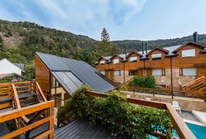 a view from the deck of a house at Del Sauco Apart & Spa in San Martín de los Andes