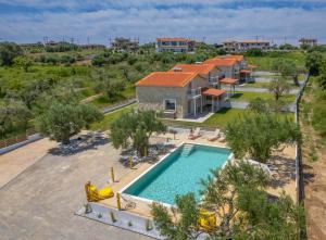 an aerial view of a villa with a swimming pool at Petra Serenity Villas in Afitos